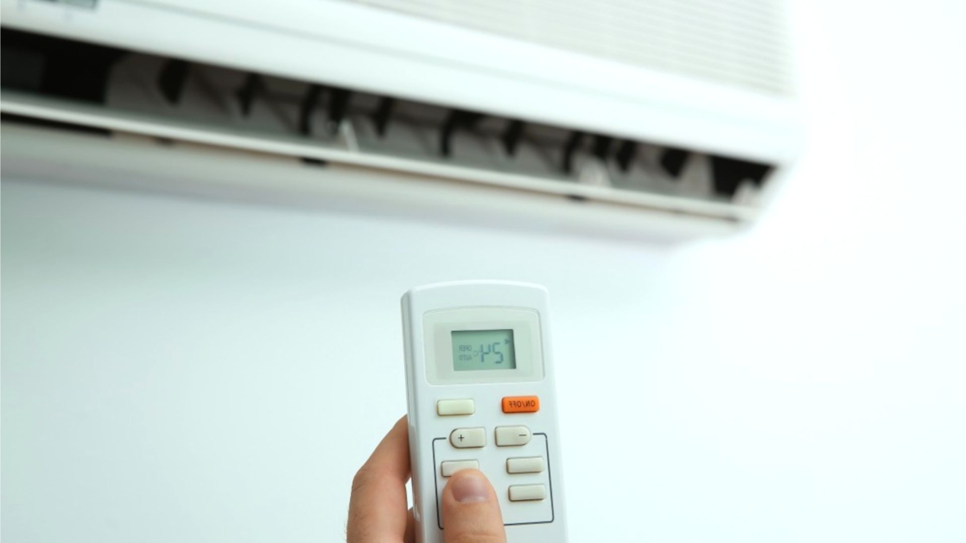Person Turning On Air Con With Remote Person Turning Air Remote