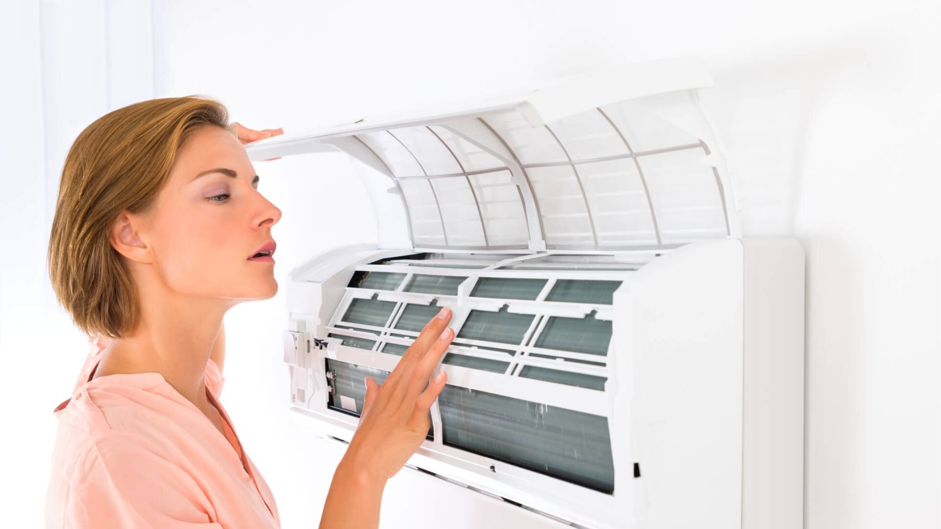 Woman Checking Ac Filter Woman Checking Ac Filter